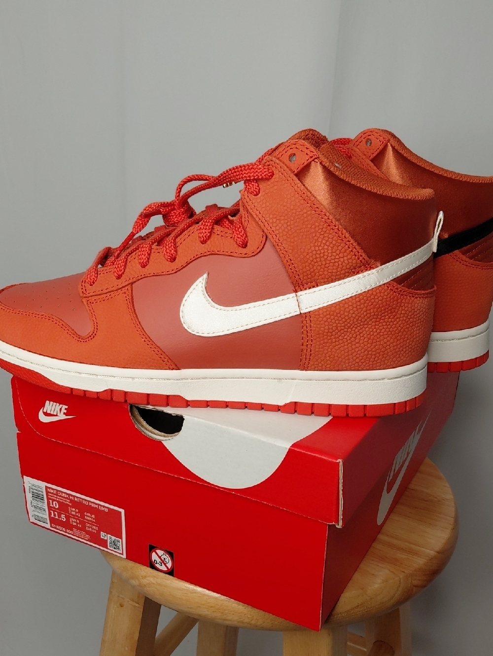 Nike Men’s Orange Mid-Top Sneakers with White Swoosh